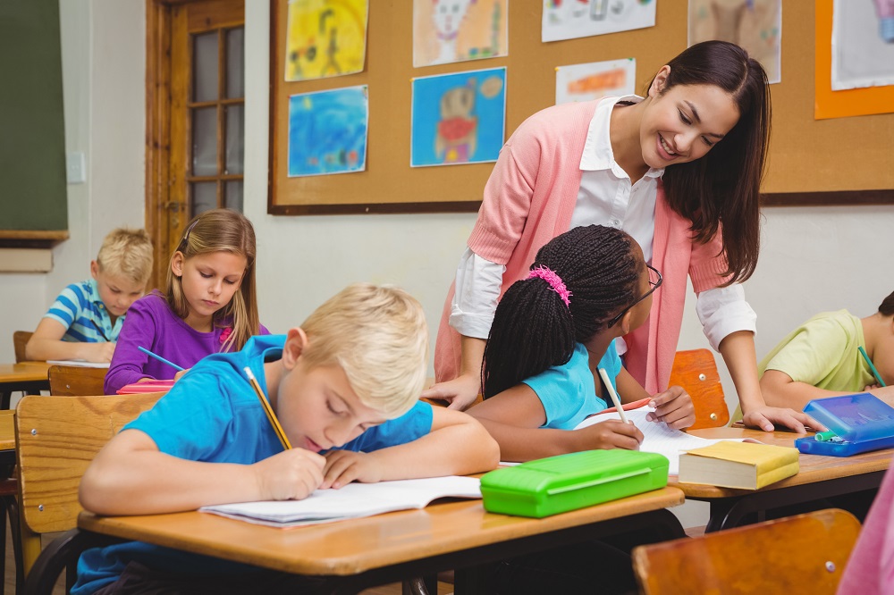 Web – Teacher smiling at children