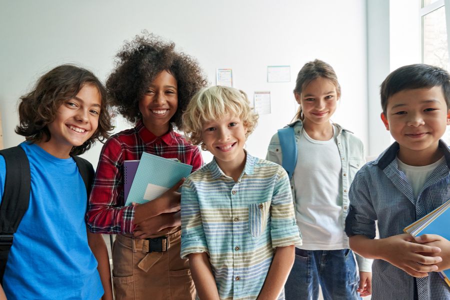 Diverse Kids In Class Diverse elementary aged kids stand in a group