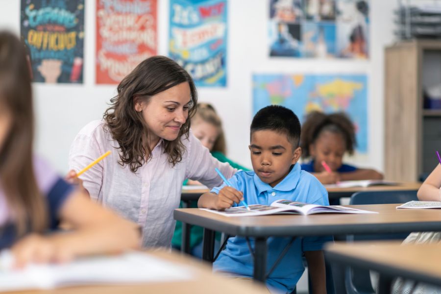 Teacher with bi-lingual student