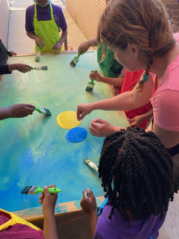 Local artist helps students paint