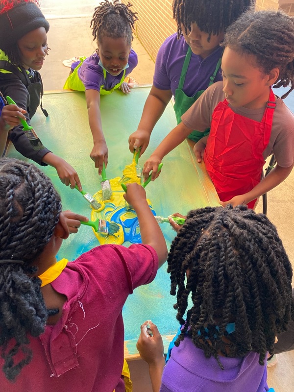 Students work together to create artwork