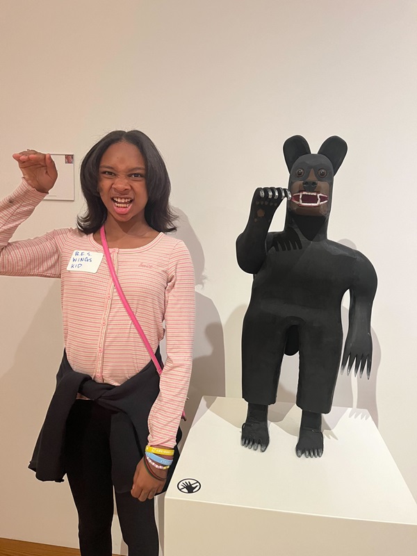 Student posing at the art museum
