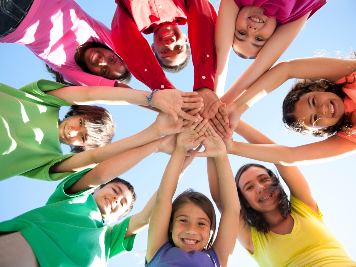 Diverse students A group of diverse students join hands